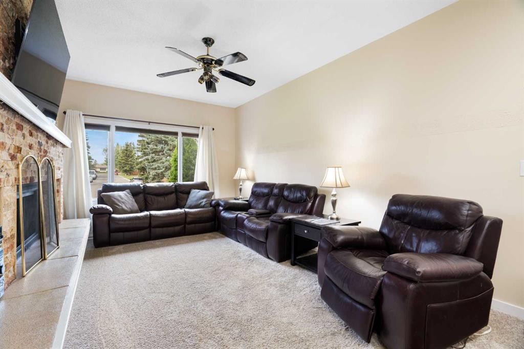 48 Deermont Way Se, Calgary, AB - Indoor Photo Showing Living Room With Fireplace