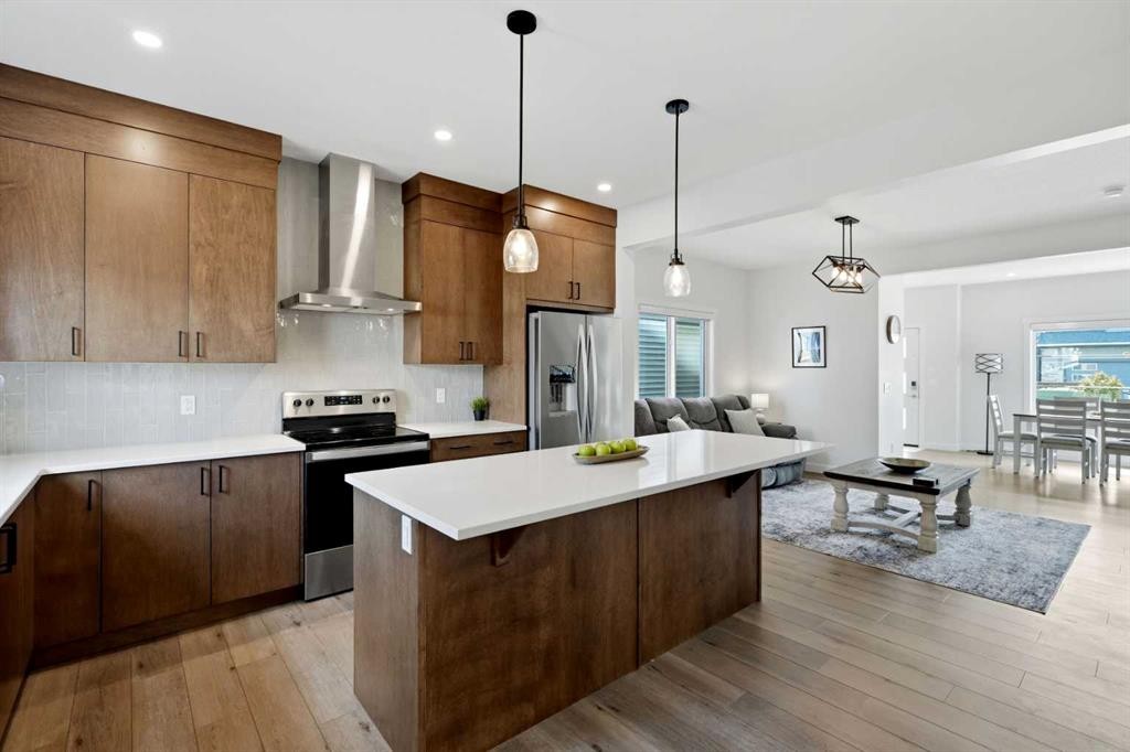 52 Emberside Grove, Cochrane, AB - Indoor Photo Showing Kitchen With Stainless Steel Kitchen With Upgraded Kitchen