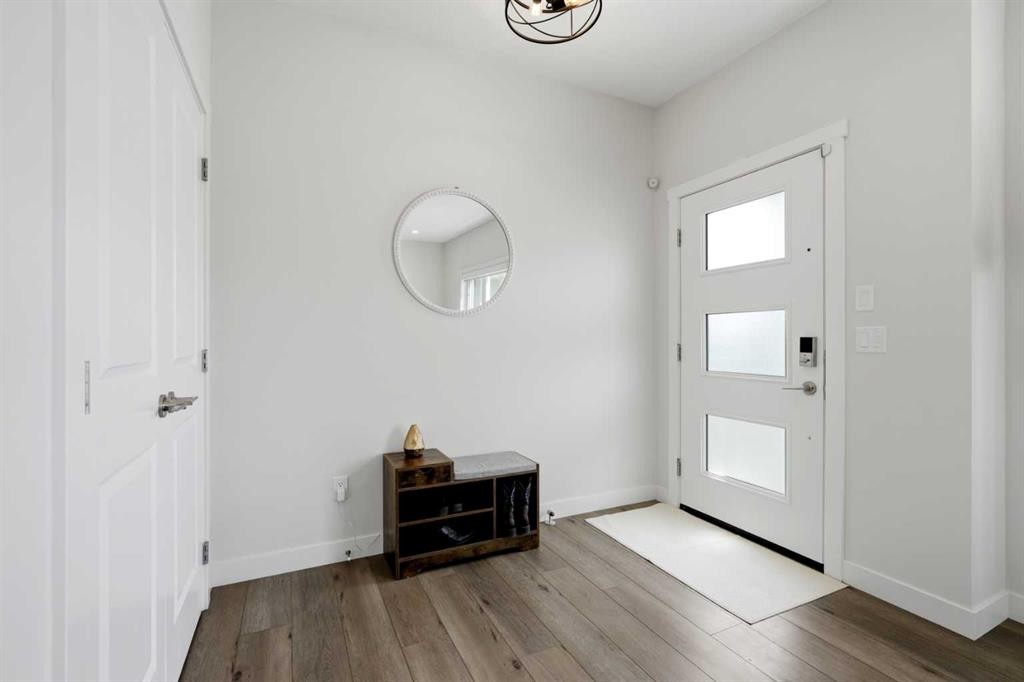 52 Emberside Grove, Cochrane, AB - Indoor Photo Showing Other Room