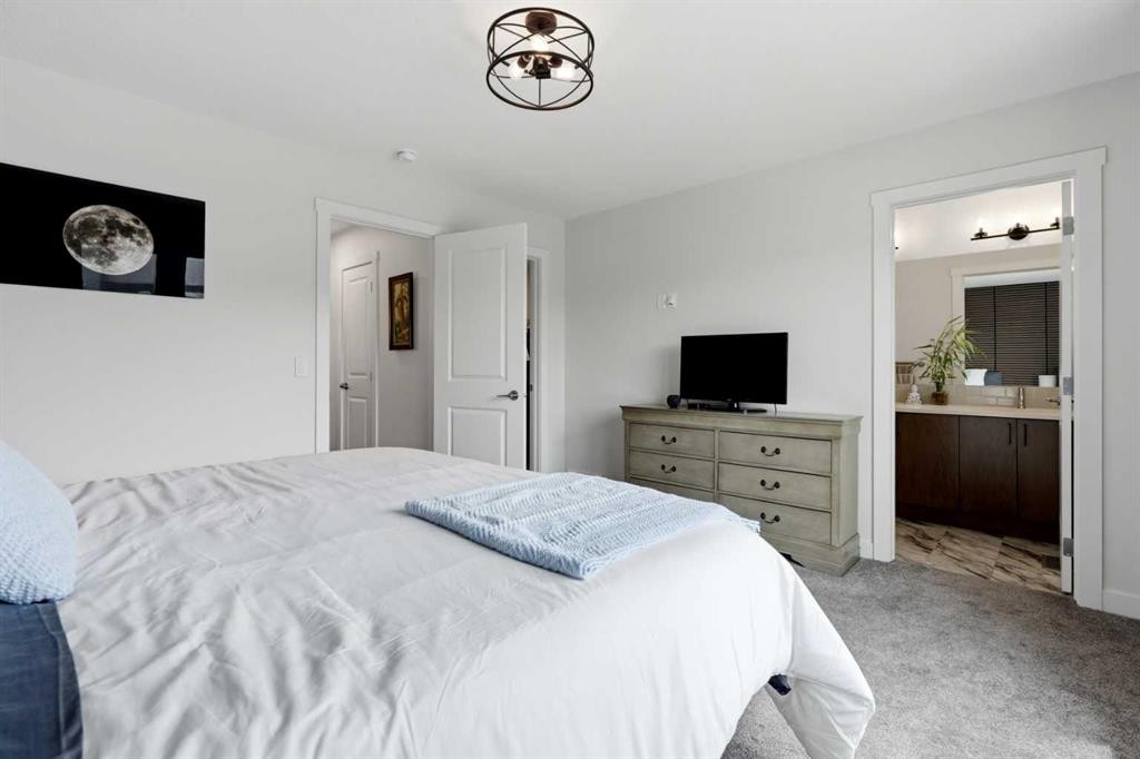 52 Emberside Grove, Cochrane, AB - Indoor Photo Showing Bedroom