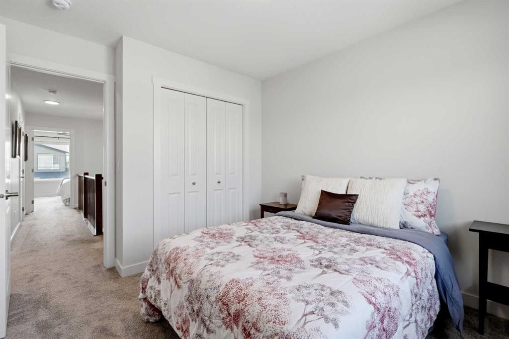 52 Emberside Grove, Cochrane, AB - Indoor Photo Showing Bedroom