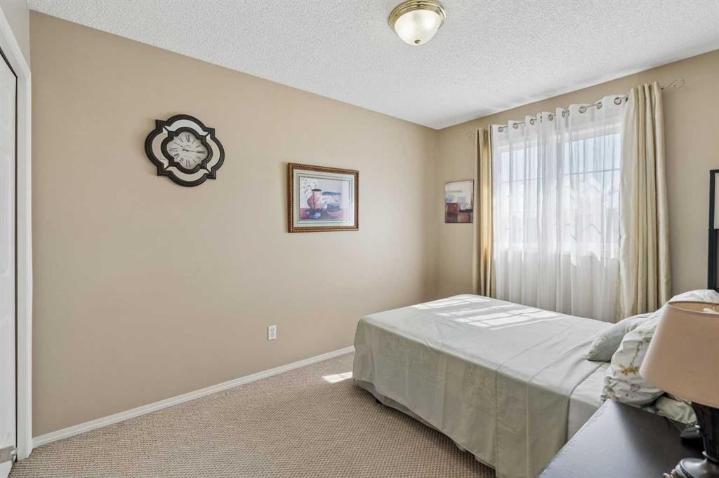 100 Applemont Close Se, Calgary, AB - Indoor Photo Showing Bedroom
