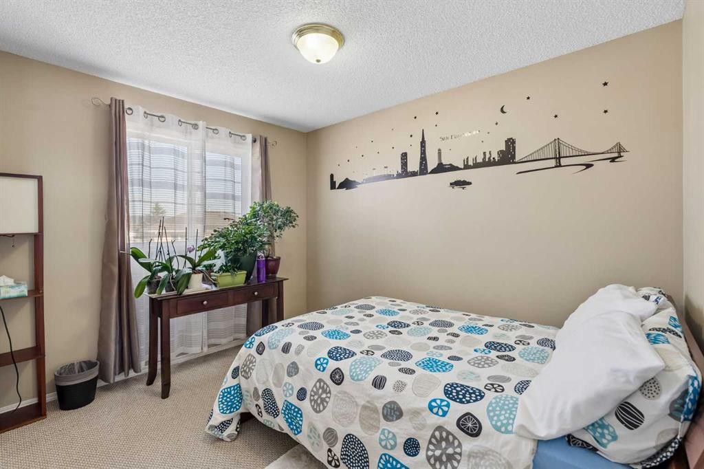 100 Applemont Close Se, Calgary, AB - Indoor Photo Showing Bedroom