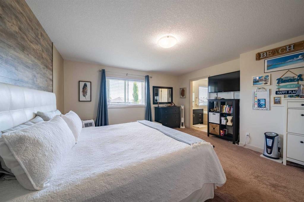 144 Everhollow Street Sw, Calgary, AB - Indoor Photo Showing Bedroom
