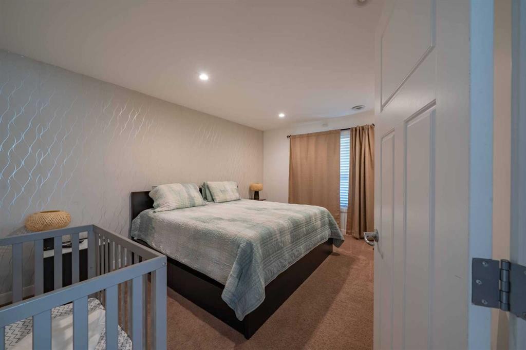 144 Everhollow Street Sw, Calgary, AB - Indoor Photo Showing Bedroom