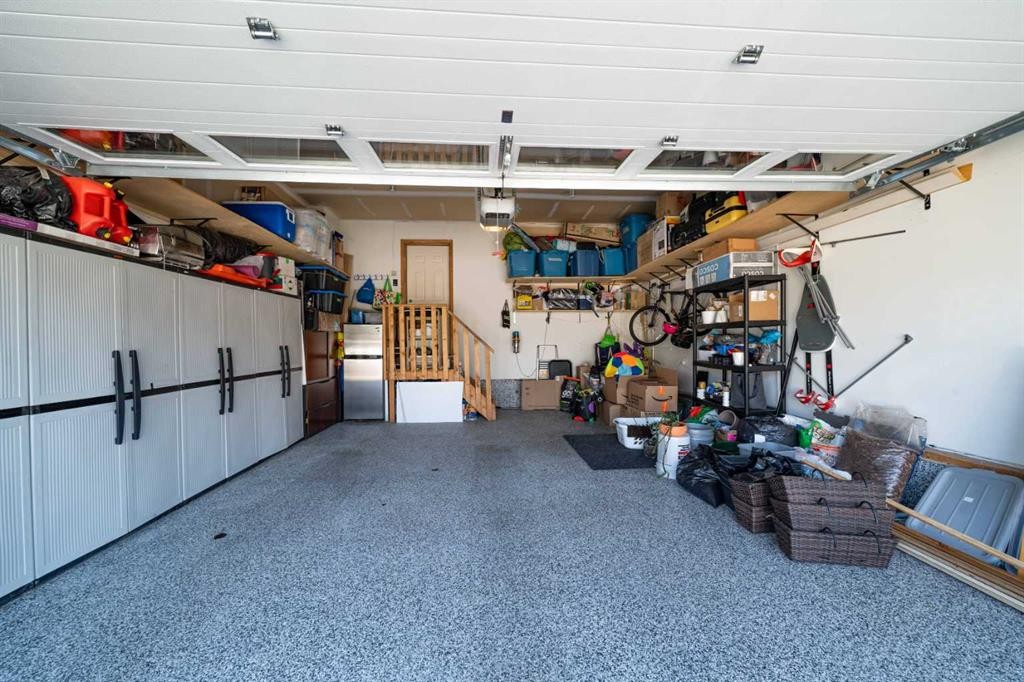 144 Everhollow Street Sw, Calgary, AB - Indoor Photo Showing Garage