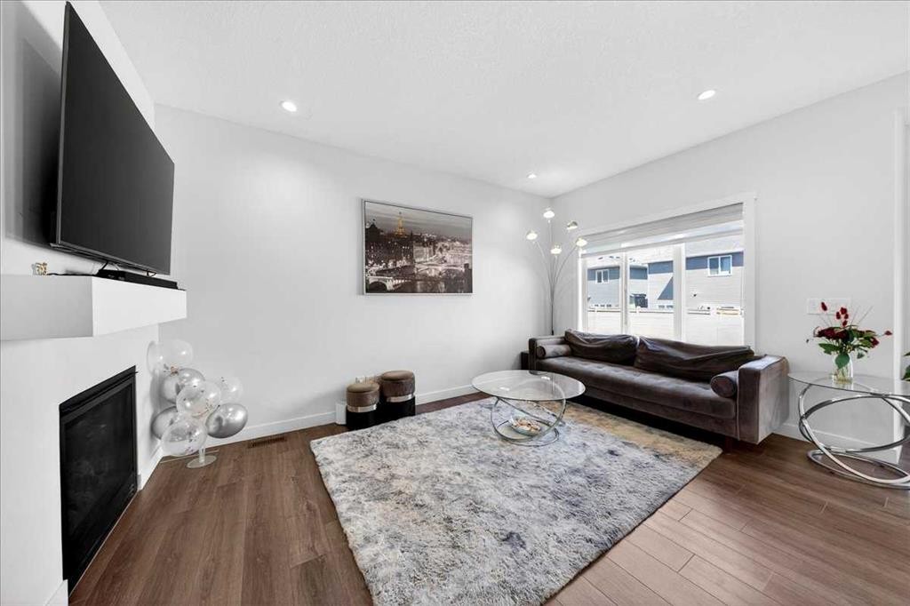 44 Saddlestone Way Ne, Calgary, AB - Indoor Photo Showing Living Room With Fireplace