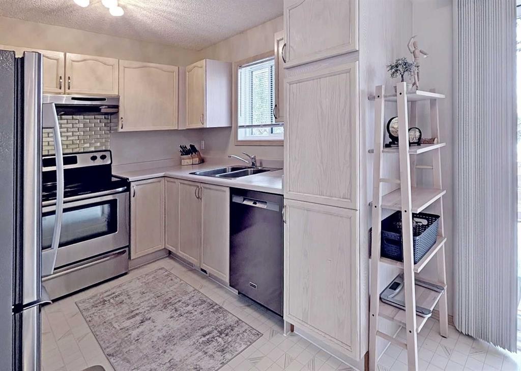 12 Shawbrooke Court Sw, Calgary, AB - Indoor Photo Showing Kitchen With Stainless Steel Kitchen With Double Sink
