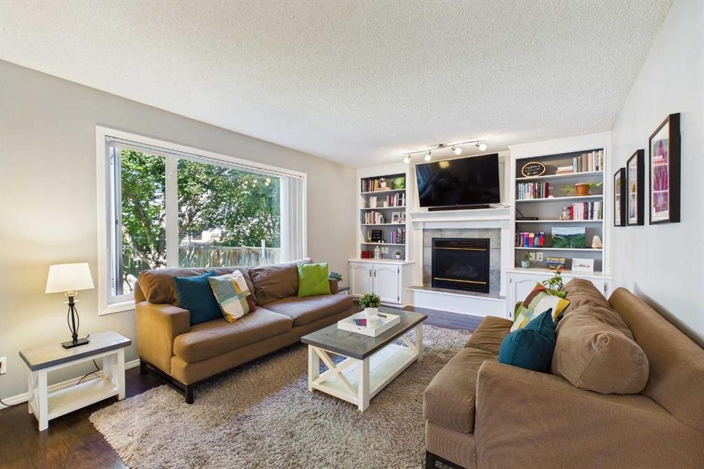 70 Coventry Crescent Ne, Calgary, AB - Indoor Photo Showing Living Room With Fireplace