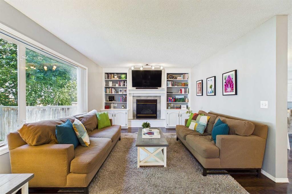 70 Coventry Crescent Ne, Calgary, AB - Indoor Photo Showing Living Room With Fireplace