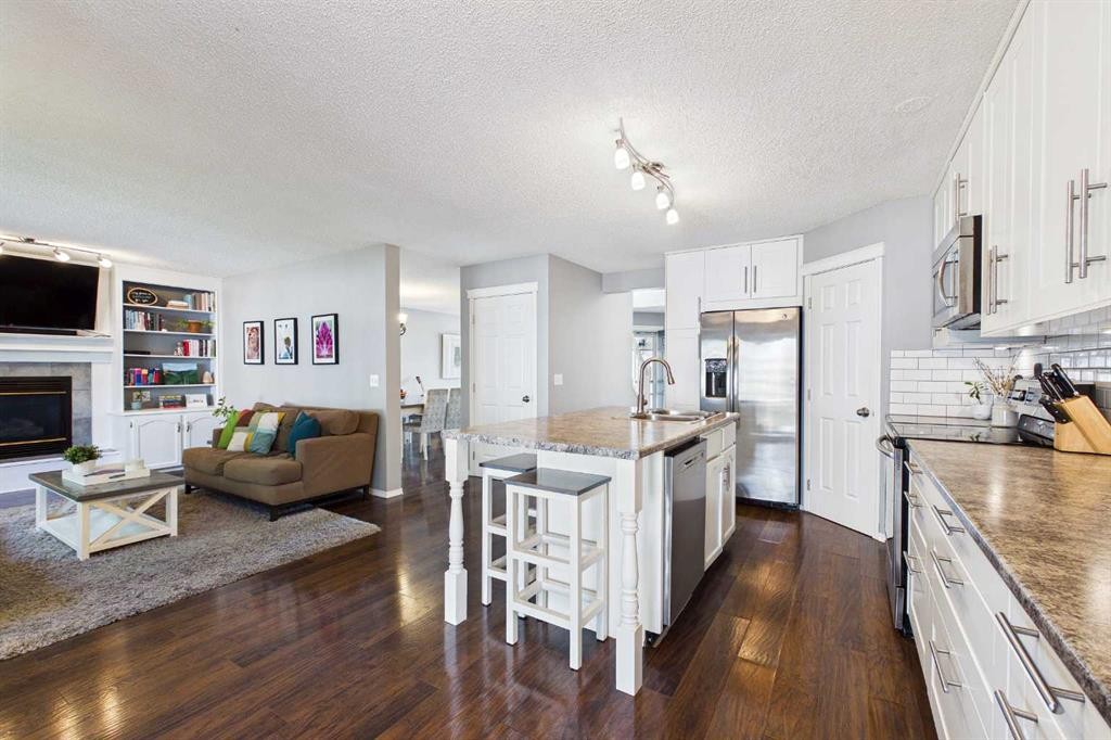 70 Coventry Crescent Ne, Calgary, AB - Indoor Photo Showing Kitchen With Fireplace With Upgraded Kitchen