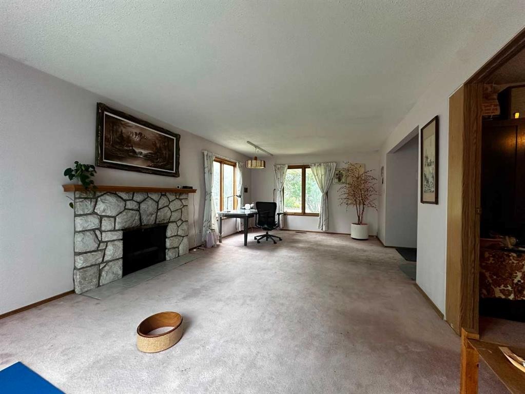 3207 Utah Place Nw, Calgary, AB - Indoor Photo Showing Living Room With Fireplace