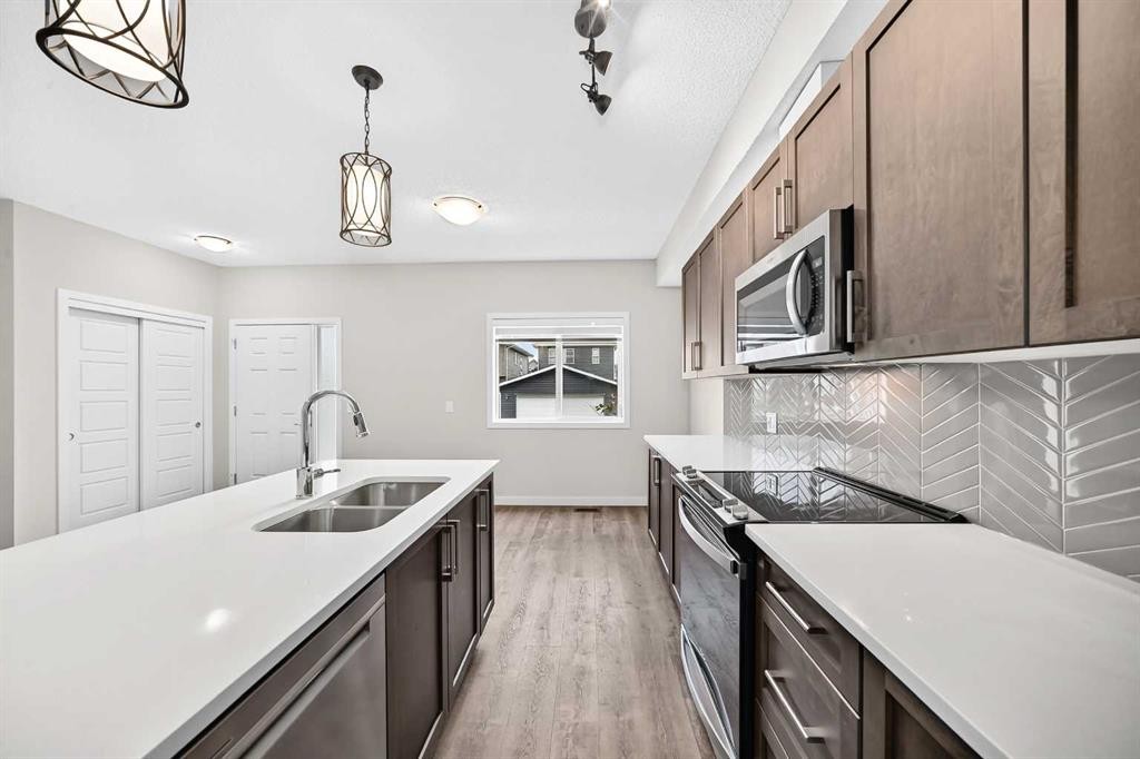 716-32 Red Embers Parade Ne, Calgary, AB - Indoor Photo Showing Kitchen With Double Sink With Upgraded Kitchen