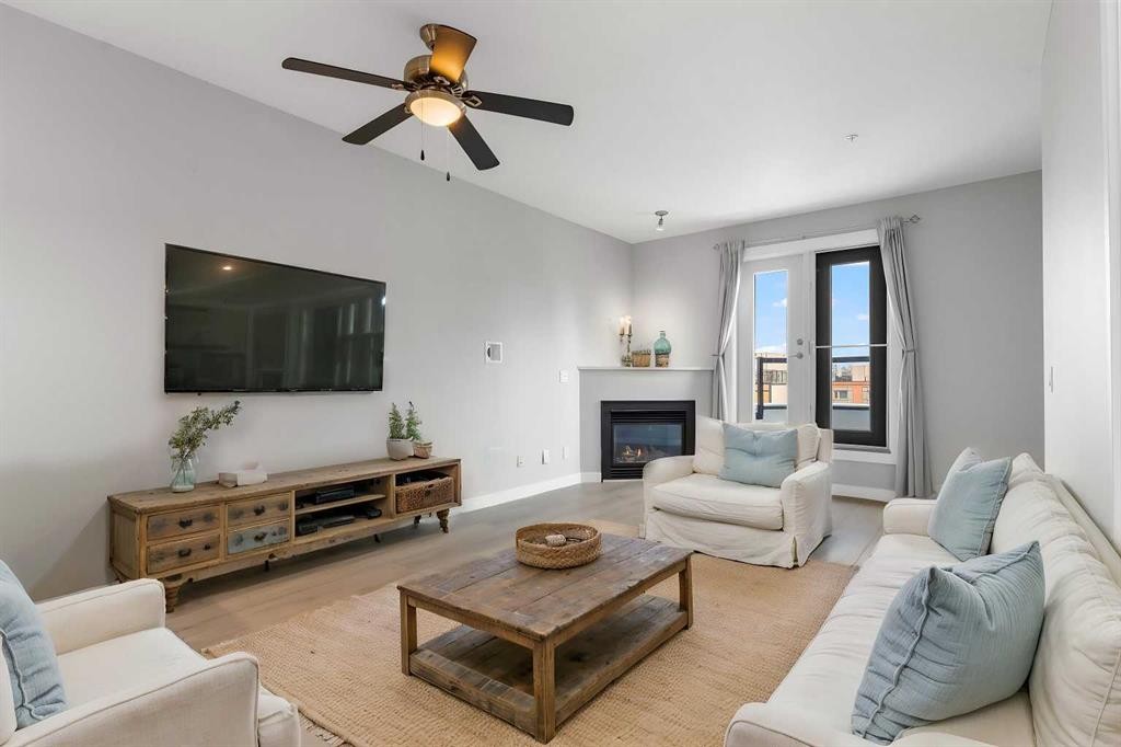 405-880 Centre Avenue Ne, Calgary, AB - Indoor Photo Showing Living Room With Fireplace