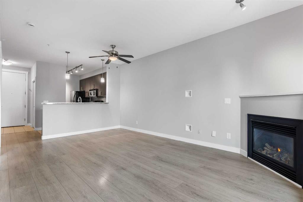 405-880 Centre Avenue Ne, Calgary, AB - Indoor Photo Showing Living Room With Fireplace