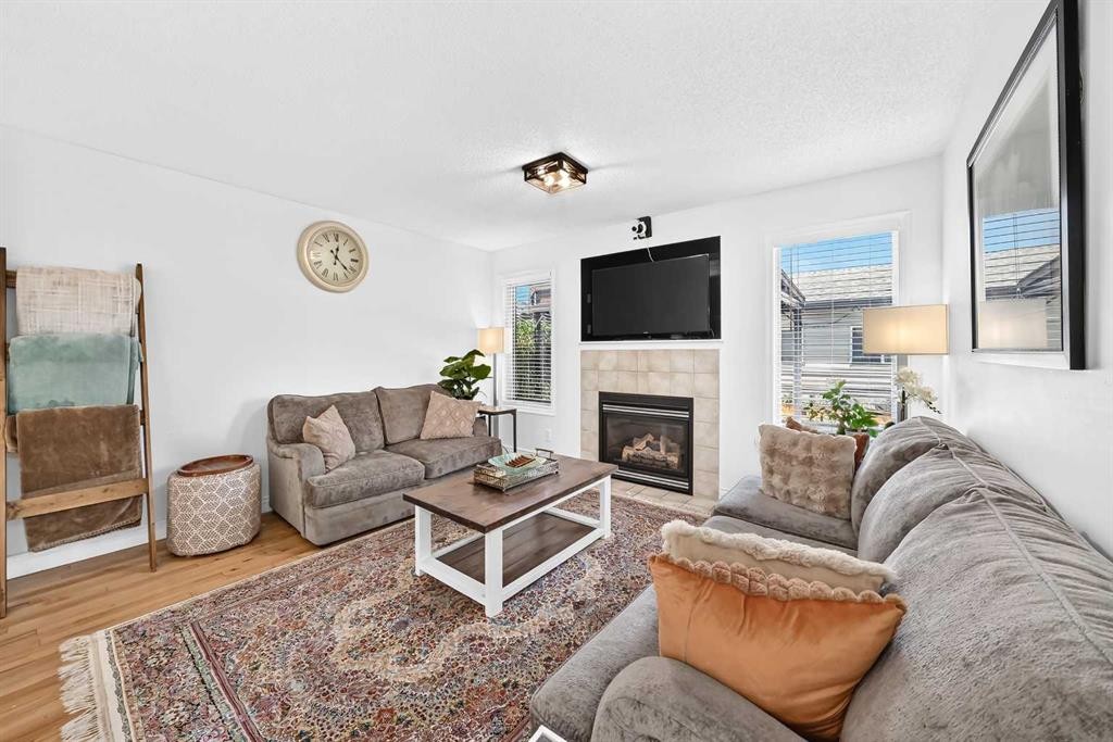 286 Prestwick Circle Se, Calgary, AB - Indoor Photo Showing Living Room With Fireplace