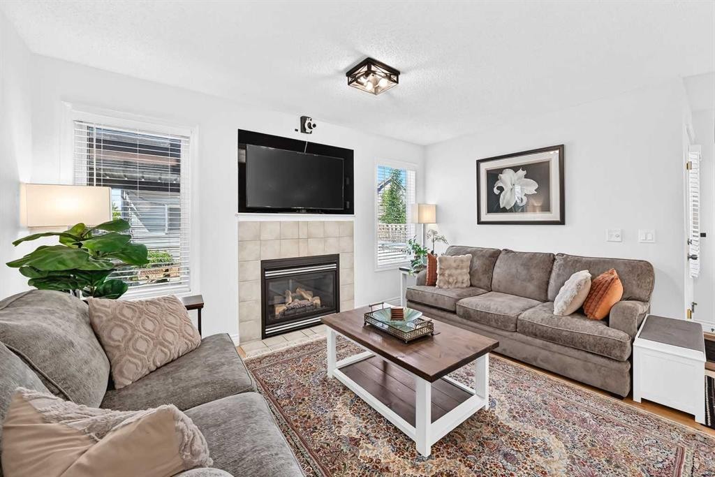 286 Prestwick Circle Se, Calgary, AB - Indoor Photo Showing Living Room With Fireplace