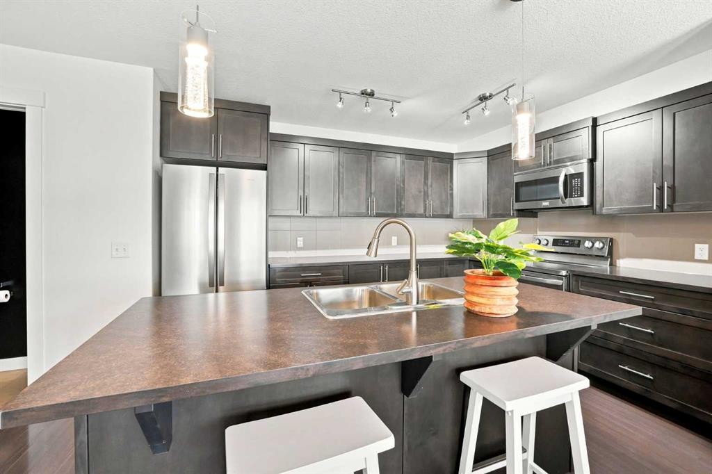 308 Redstone View Ne, Calgary, AB - Indoor Photo Showing Kitchen With Stainless Steel Kitchen With Double Sink With Upgraded Kitchen