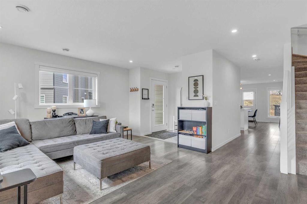 302-260 Rowley Way Nw, Calgary, AB - Indoor Photo Showing Living Room With Fireplace