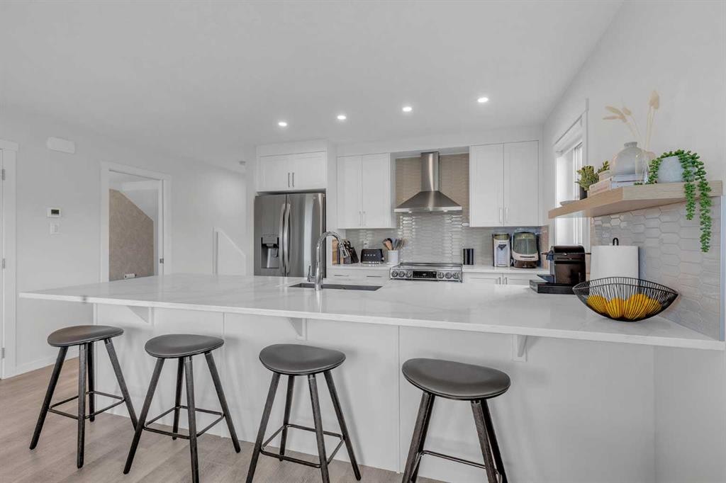302-260 Rowley Way Nw, Calgary, AB - Indoor Photo Showing Kitchen With Upgraded Kitchen