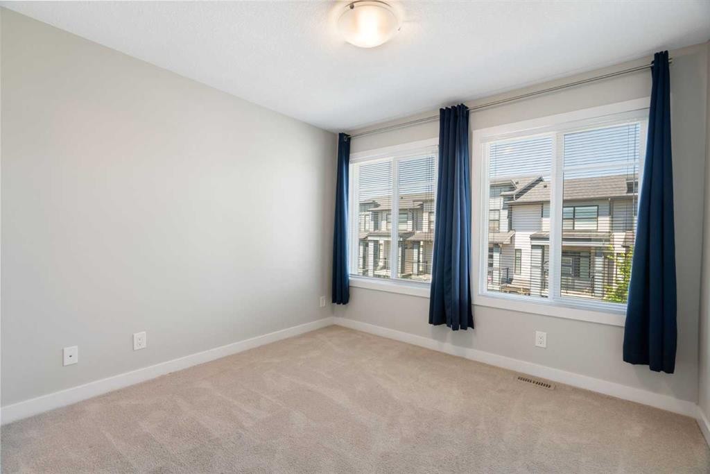 28-138 Seton Passage Se, Calgary, AB - Indoor Photo Showing Other Room