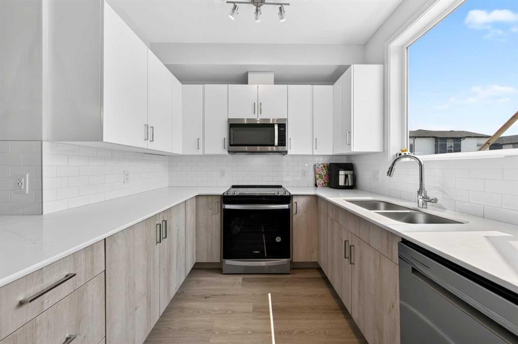 363-301 Redstone Boulevard Ne, Calgary, AB - Indoor Photo Showing Kitchen With Double Sink