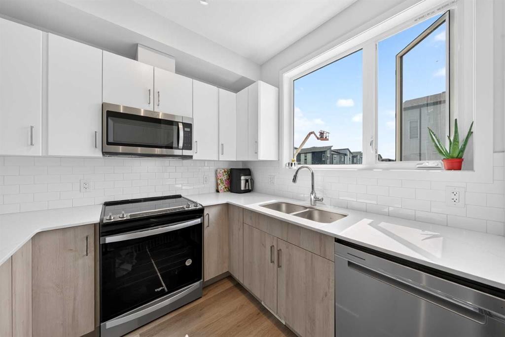 363-301 Redstone Boulevard Ne, Calgary, AB - Indoor Photo Showing Kitchen With Double Sink