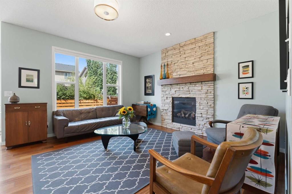 48 Brightoncrest Manor Se, Calgary, AB - Indoor Photo Showing Living Room With Fireplace