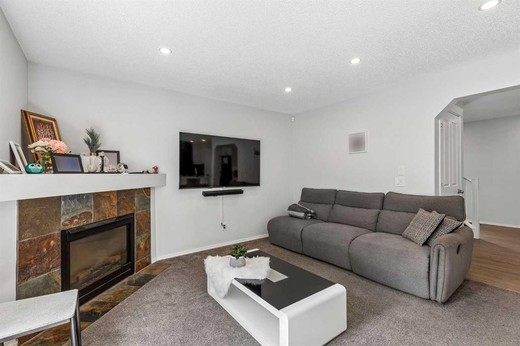 60 Cranfield Park Se, Calgary, AB - Indoor Photo Showing Living Room With Fireplace