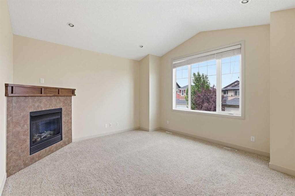 47 Evanspark Circle, Calgary, AB - Indoor Photo Showing Other Room With Fireplace
