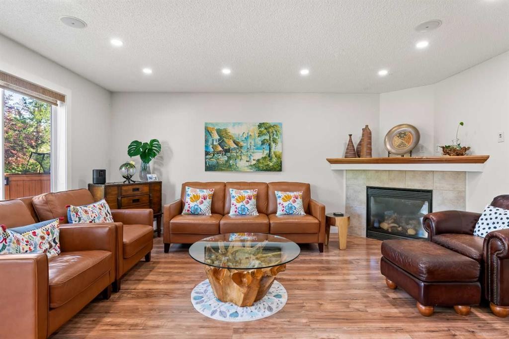 114 Chapalina Terrace Se, Calgary, AB - Indoor Photo Showing Living Room With Fireplace
