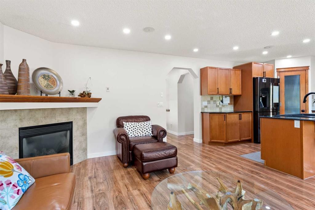 114 Chapalina Terrace Se, Calgary, AB - Indoor Photo Showing Other Room With Fireplace