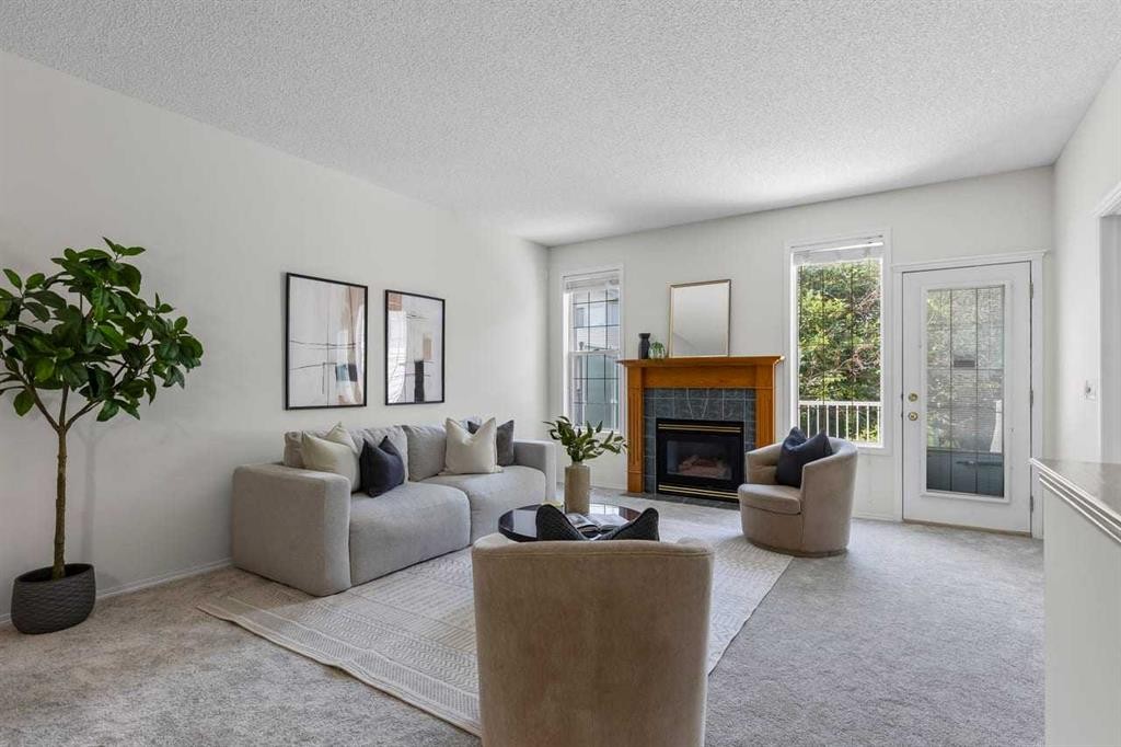 139 Hidden Valley Green Nw, Calgary, AB - Indoor Photo Showing Living Room With Fireplace