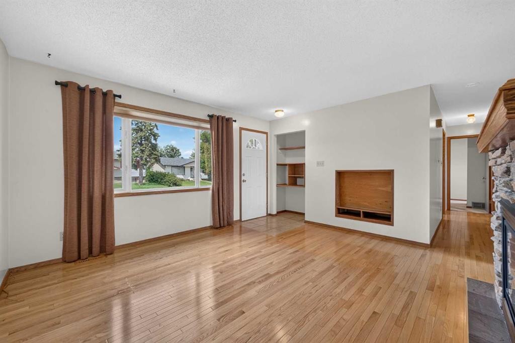 4639 Marbank Drive, Calgary, AB - Indoor Photo Showing Other Room With Fireplace