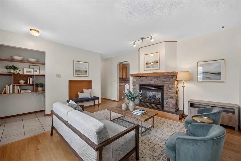 4639 Marbank Drive, Calgary, AB - Indoor Photo Showing Living Room With Fireplace
