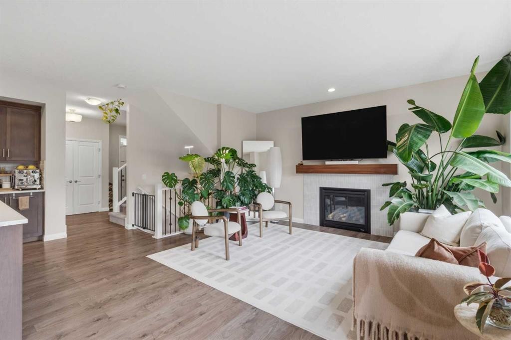26 Evansfield Park Nw, Calgary, AB - Indoor Photo Showing Living Room With Fireplace