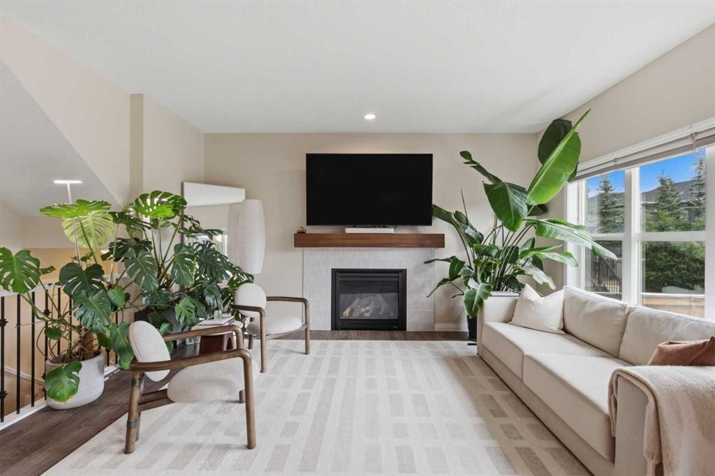 26 Evansfield Park Nw, Calgary, AB - Indoor Photo Showing Living Room With Fireplace
