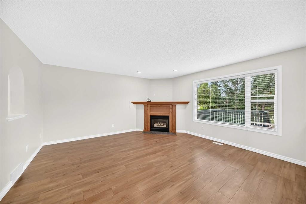 247 Covington Close Ne, Calgary, AB - Indoor Photo Showing Living Room With Fireplace