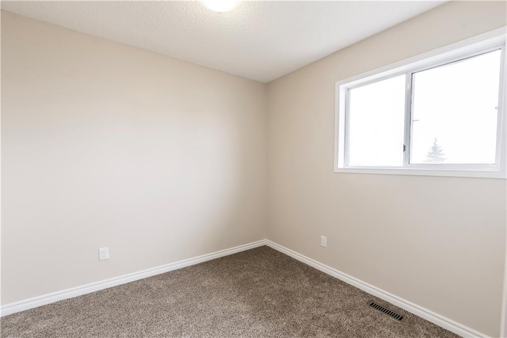 1019 Smith Avenue, Crossfield, AB - Indoor Photo Showing Other Room