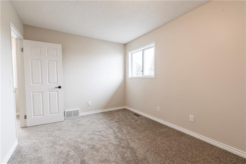 1019 Smith Avenue, Crossfield, AB - Indoor Photo Showing Other Room