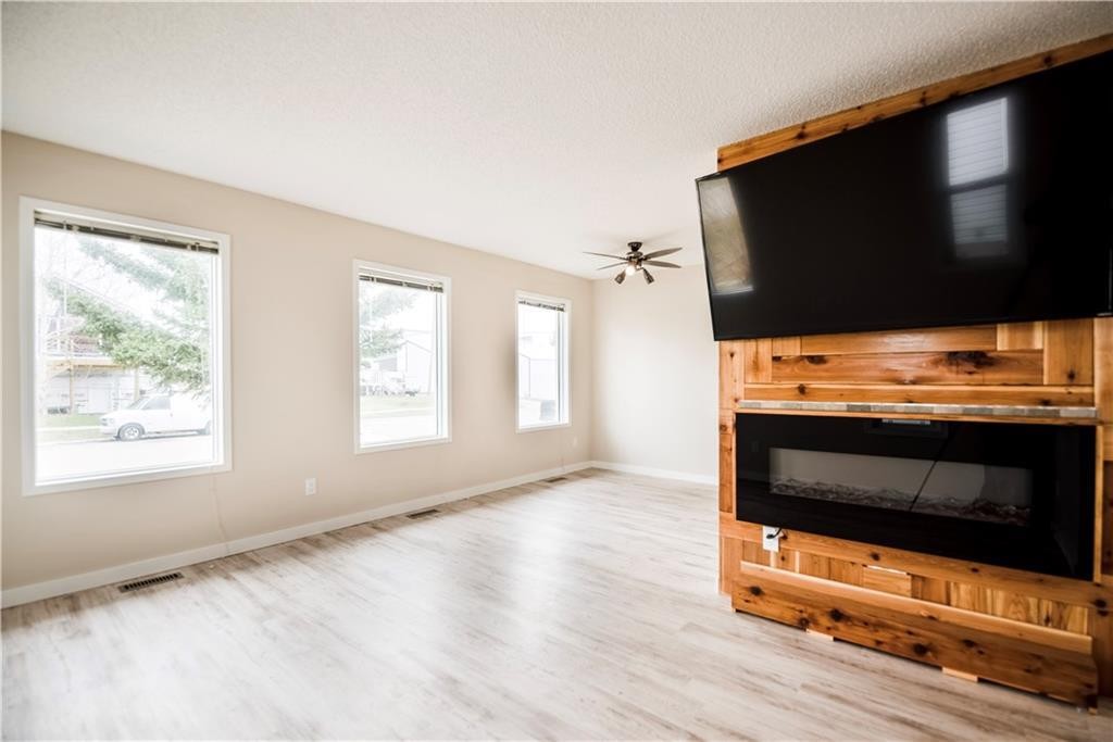 1019 Smith Avenue, Crossfield, AB - Indoor With Fireplace