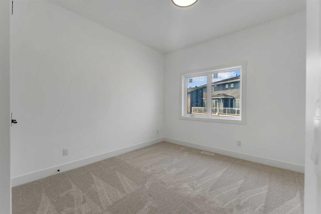 39 Heritage Ridge, Cochrane, AB - Indoor Photo Showing Other Room
