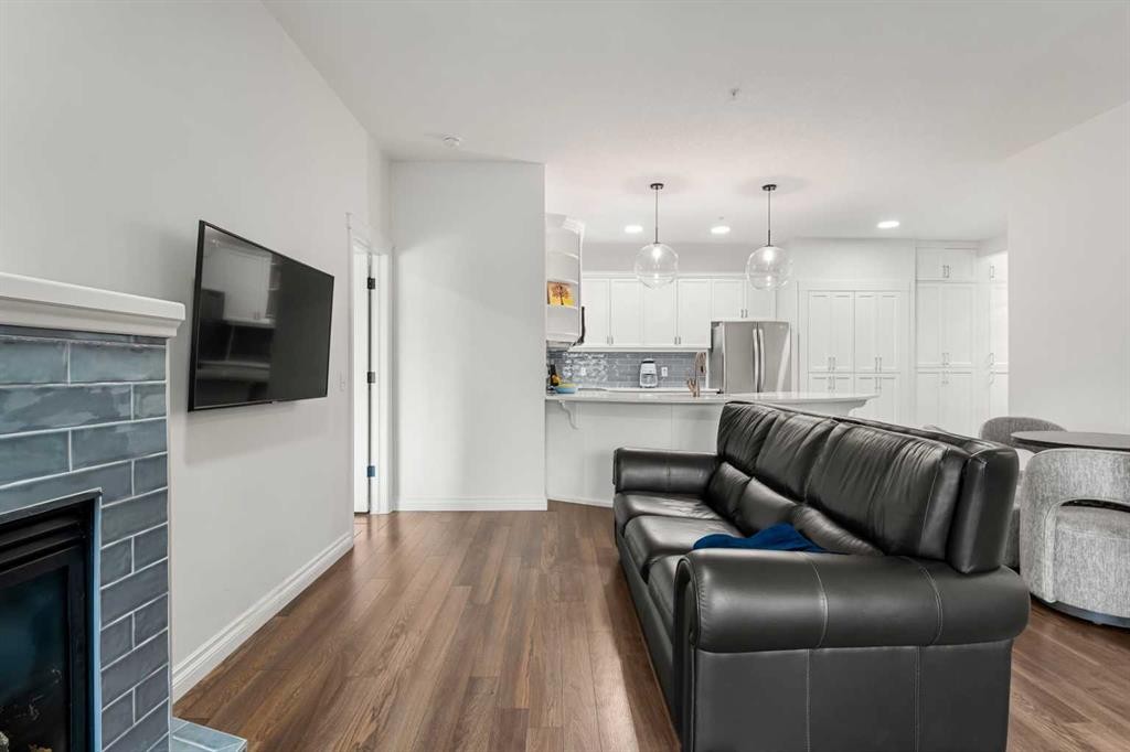 5208-14 Hemlock Crescent Sw, Calgary, AB - Indoor Photo Showing Living Room With Fireplace