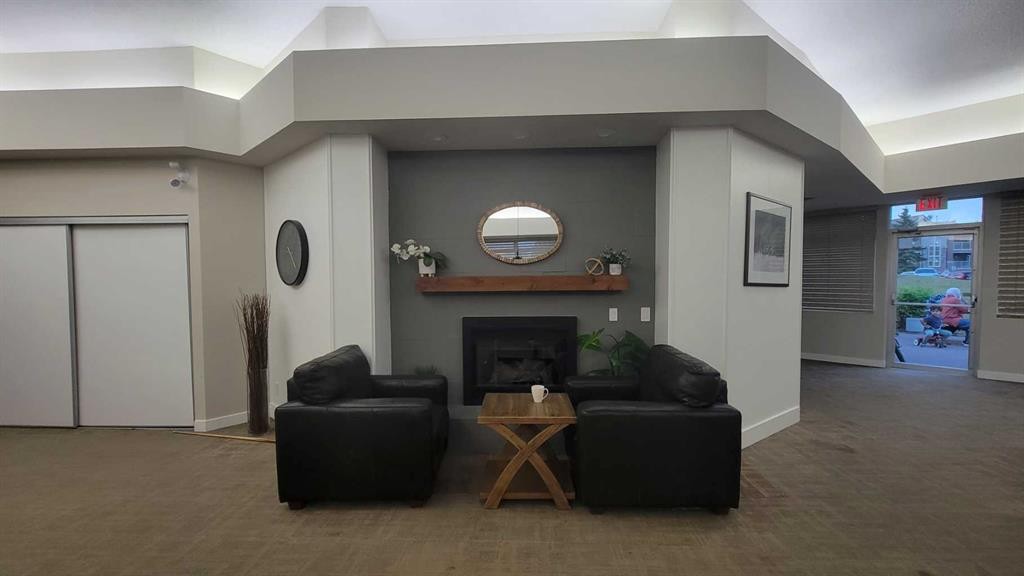 13-2000 Edenwold Heights Nw, Calgary, AB - Indoor With Fireplace