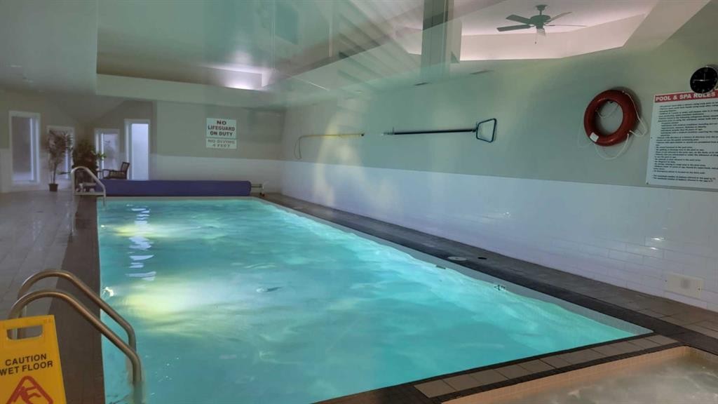 13-2000 Edenwold Heights Nw, Calgary, AB - Indoor Photo Showing Other Room With In Ground Pool