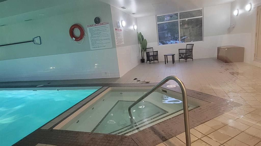13-2000 Edenwold Heights Nw, Calgary, AB - Indoor Photo Showing Other Room With In Ground Pool