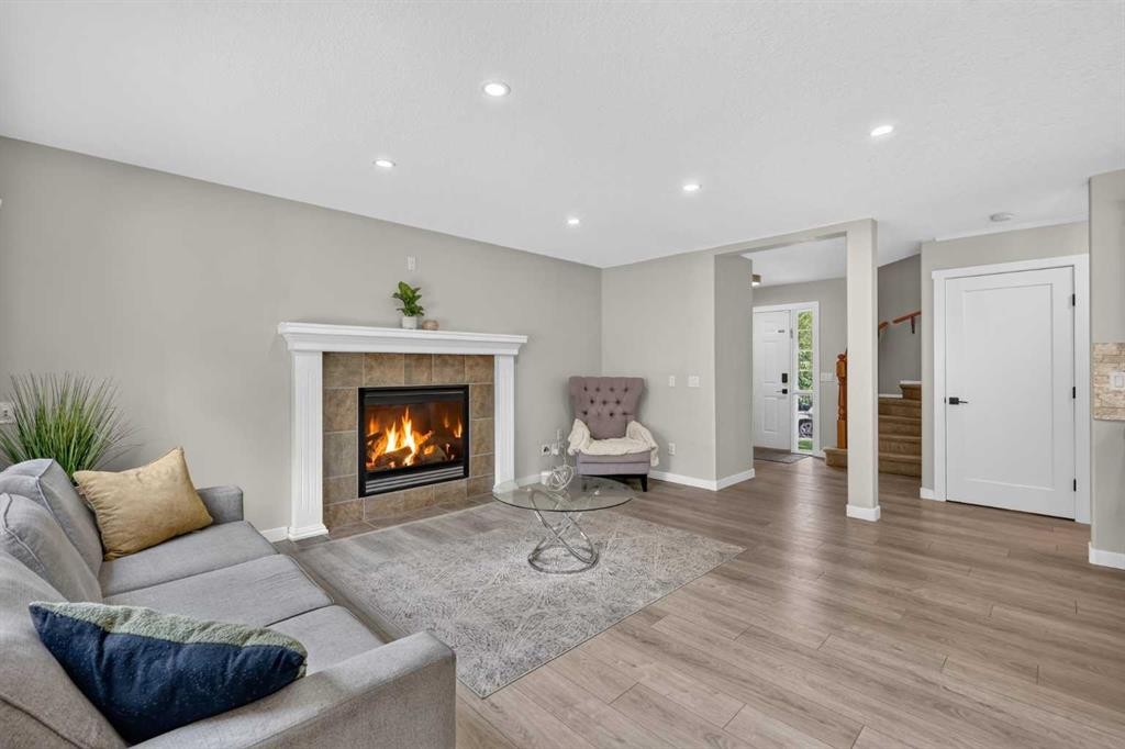 261 Panamount Hill Nw, Calgary, AB - Indoor Photo Showing Living Room With Fireplace