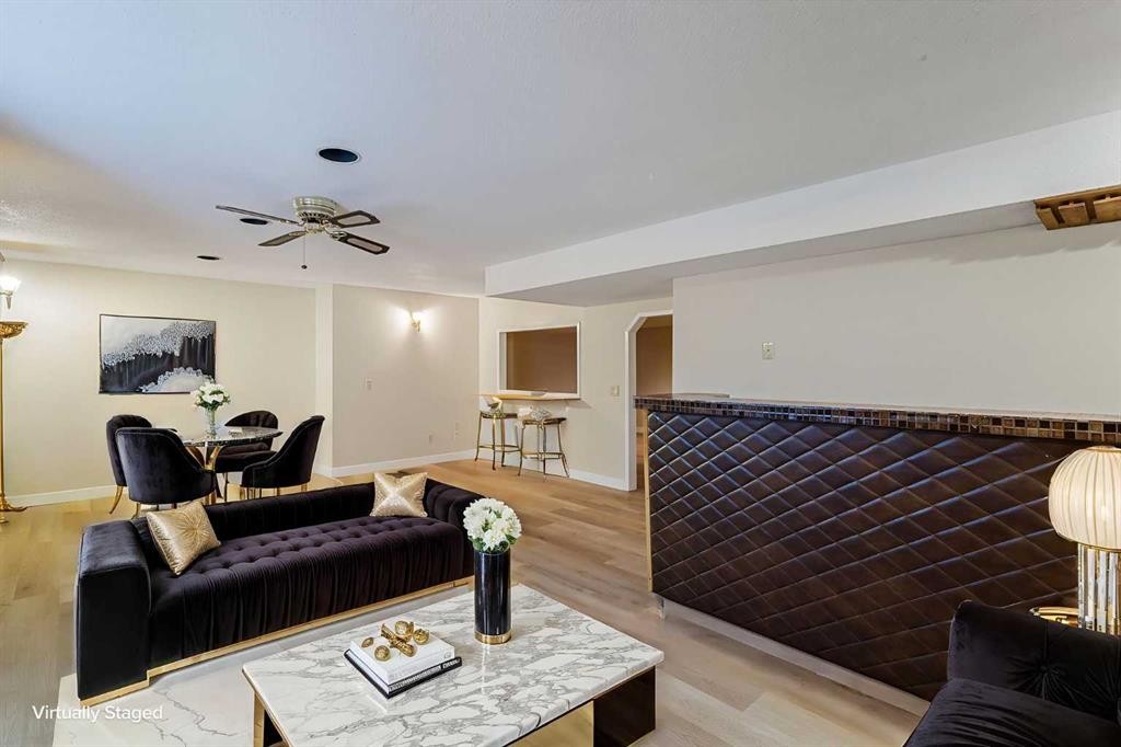 1111 Berkley Drive Nw, Calgary, AB - Indoor Photo Showing Living Room With Fireplace