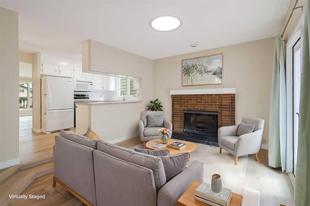 1111 Berkley Drive Nw, Calgary, AB - Indoor Photo Showing Living Room With Fireplace