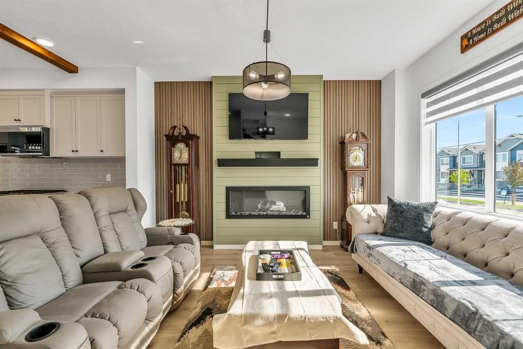 7 Emberside Park, Cochrane, AB - Indoor Photo Showing Living Room With Fireplace
